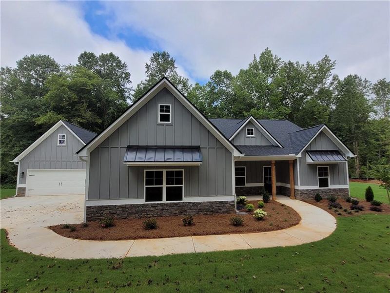 Front exterior of a new home in , Dallas, GA, highlighting curb appeal (Image 1). Front exterior of a new home in , Dallas, GA, highlighting curb appeal (Image 1).