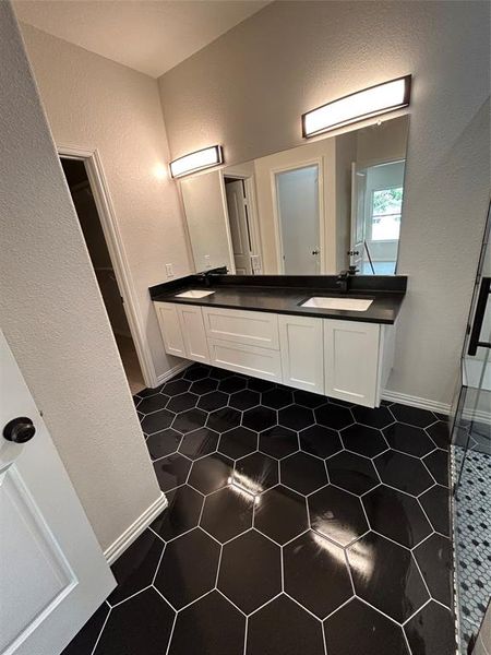 Bathroom with walk in shower and vanity