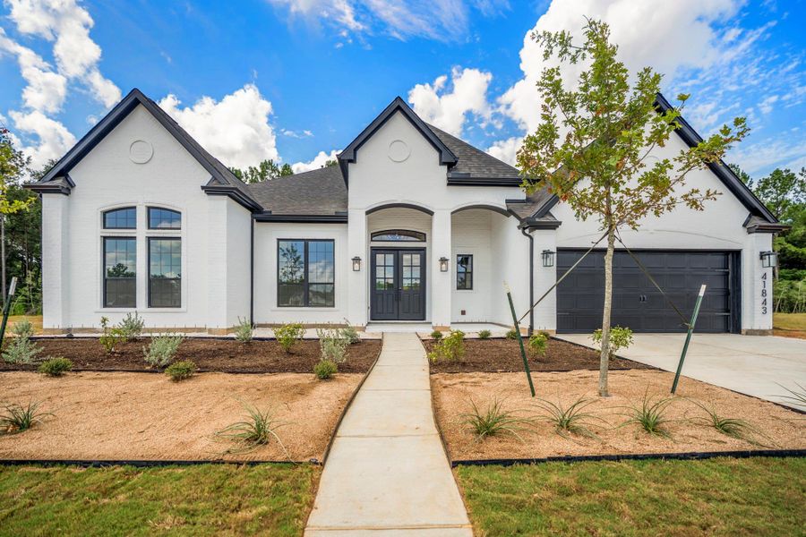 Front exterior of a new home in Colton, Todd Mission, TX, highlighting curb appeal (Image 26). Front exterior of a new home in Colton, Todd Mission, TX, highlighting curb appeal (Image 26).