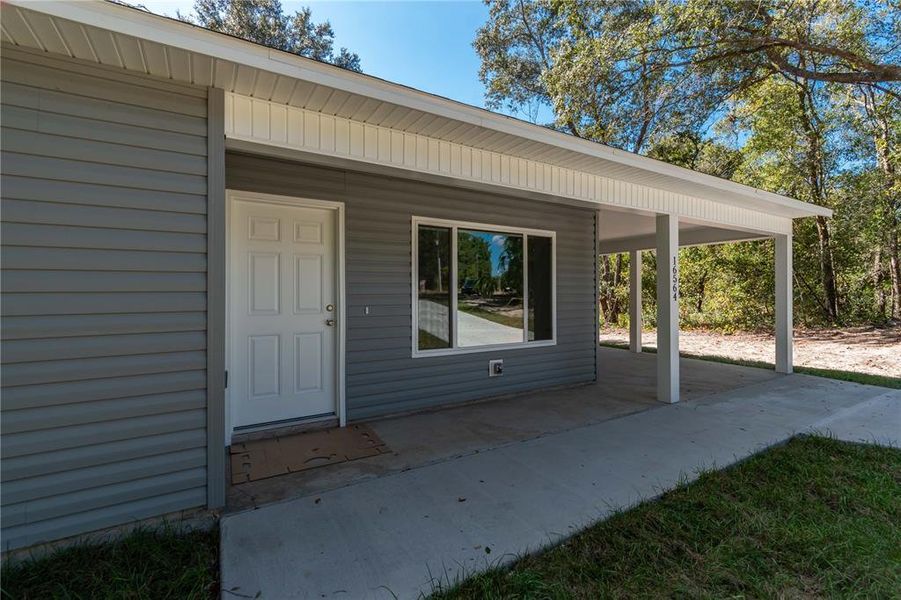 Front exterior of a new home in , Ocklawaha, FL, highlighting curb appeal (Image 12).