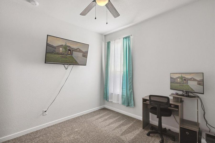 Office area with carpet and ceiling fan Office area with carpet and ceiling fan