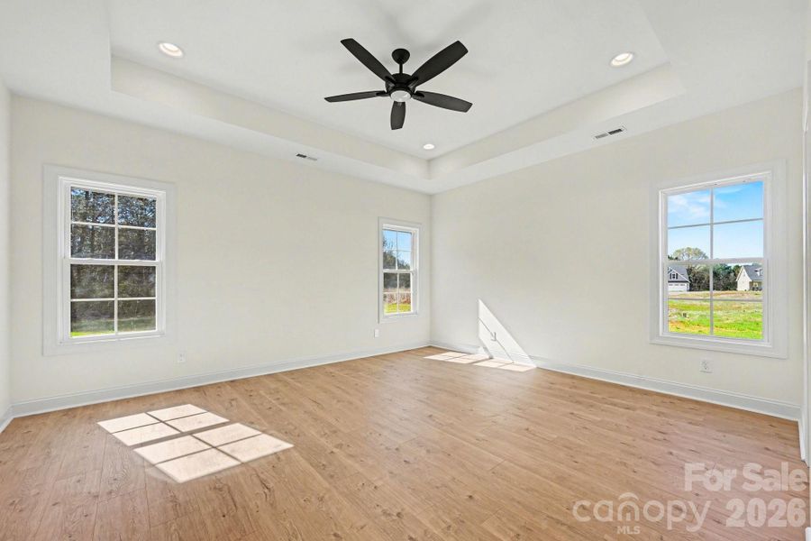 primary bedroom with trey ceiling