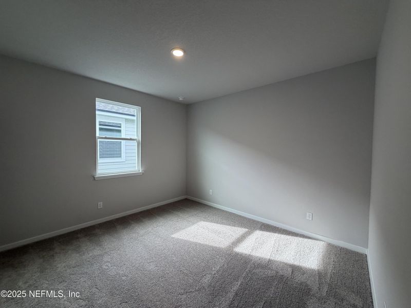 Spacious, unfurnished interior of a new home in The Magnolia Series at Reserve East, Flagler Beach (Image 24).