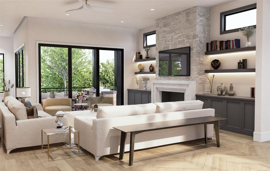 Designed with connection in mind, this living room opens effortlessly to a covered patio through oversized glass doors. Interior textures, from soft upholstery to stone and wood create a layered, inviting environment, while the layout supports seamless flow between entertaining, dining, and everyday lounging.