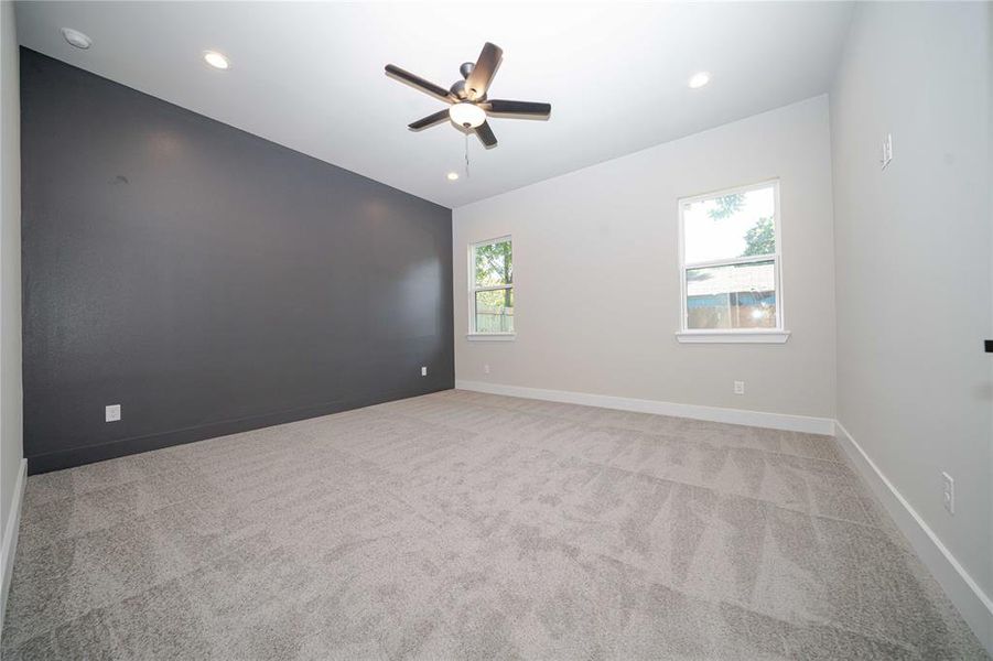 Spare room with light carpet, recessed lighting, and ceiling fan Spare room with light carpet, recessed lighting, and ceiling fan