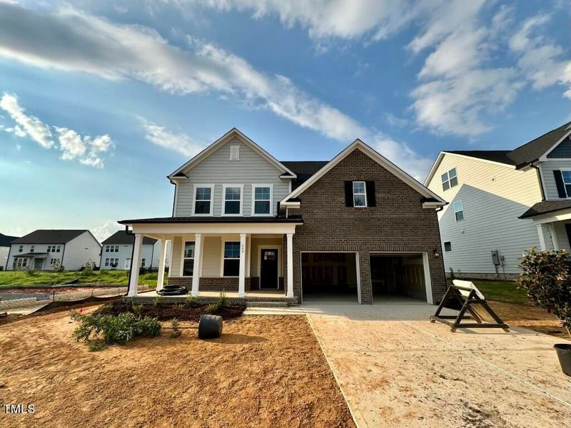 Front exterior of a new home in Glenmere, Knightdale, NC, highlighting curb appeal (Image 114). Front exterior of a new home in Glenmere, Knightdale, NC, highlighting curb appeal (Image 114).