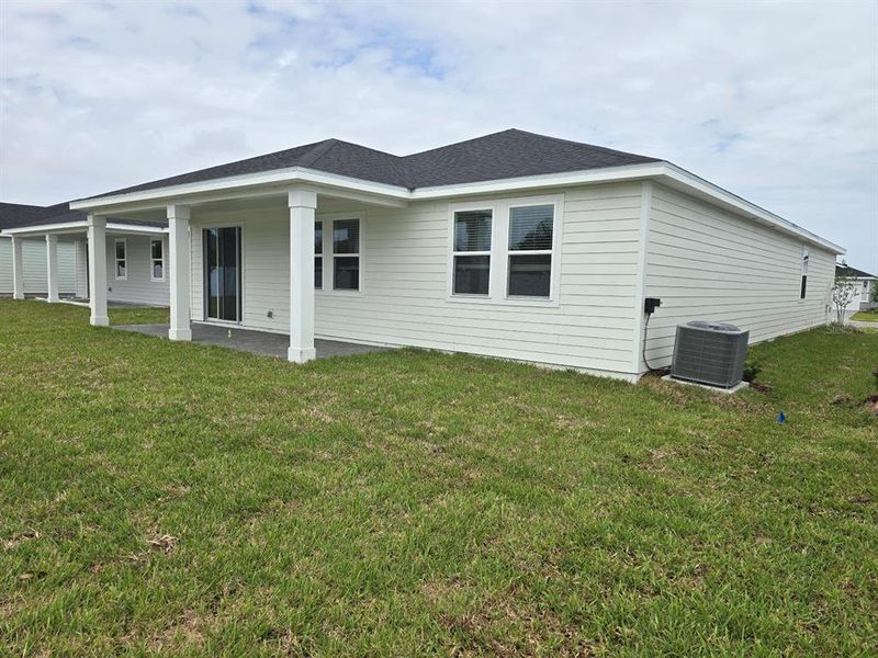 Exterior details and patio area of a home in Colbert Landings, Palm Coast (Image 3).