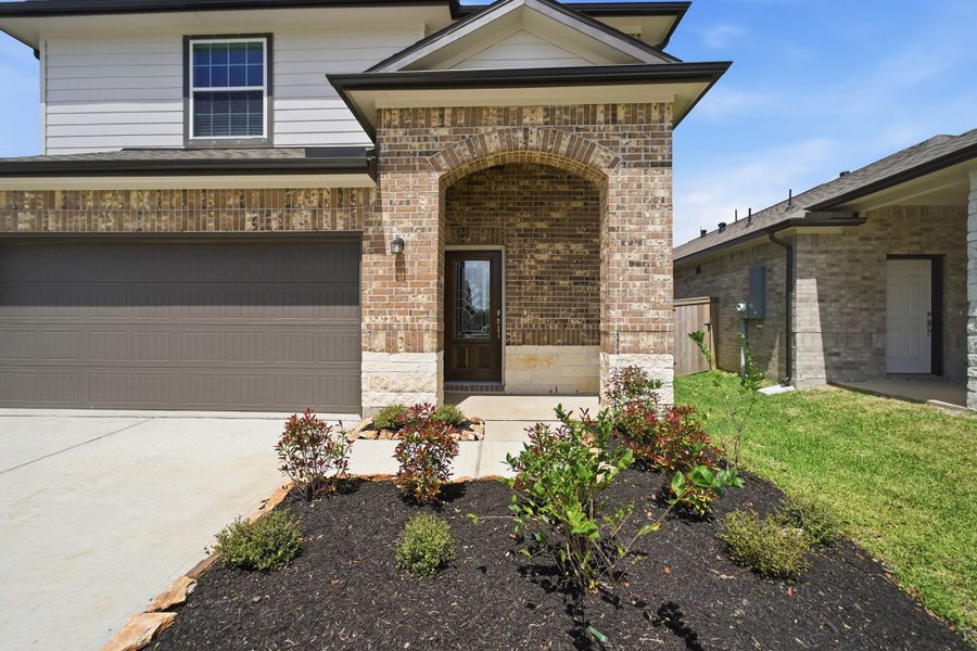 Exterior details and patio area of a home in Windrose Green, Angleton (Image 3).