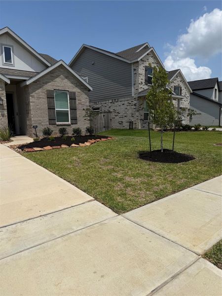 Front exterior of a new home in , Hockley, TX, highlighting curb appeal (Image 21).