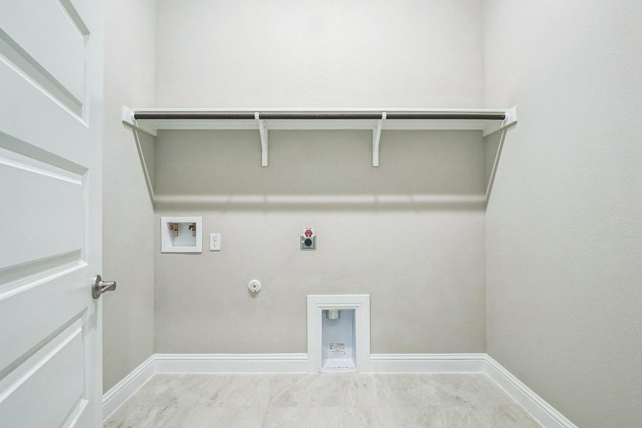 Washroom featuring baseboards, washer hookup, hookup for a gas dryer, laundry area, and electric dryer hookup