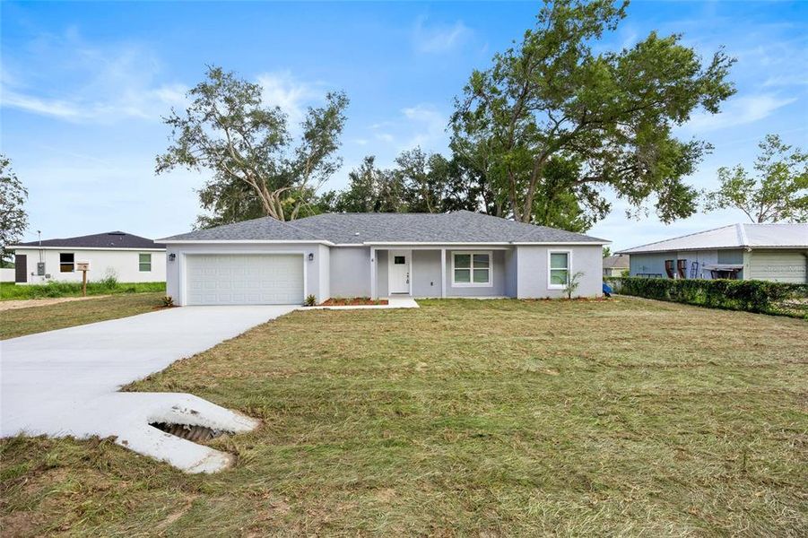Front exterior of a new home in , Ocala, FL, highlighting curb appeal (Image 1). Front exterior of a new home in , Ocala, FL, highlighting curb appeal (Image 1).