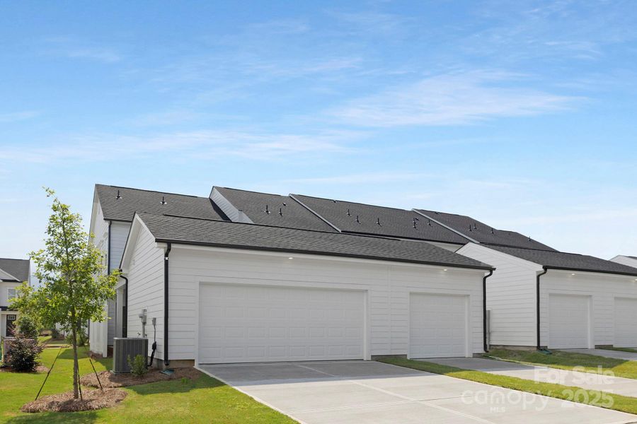Front exterior of a new home in Edgewood Preserve, Huntersville, NC, highlighting curb appeal (Image 20). Front exterior of a new home in Edgewood Preserve, Huntersville, NC, highlighting curb appeal (Image 20).