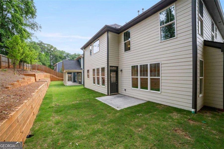 Exterior details and patio area of a home in The Villages at Whites Mill, Decatur (Image 2).