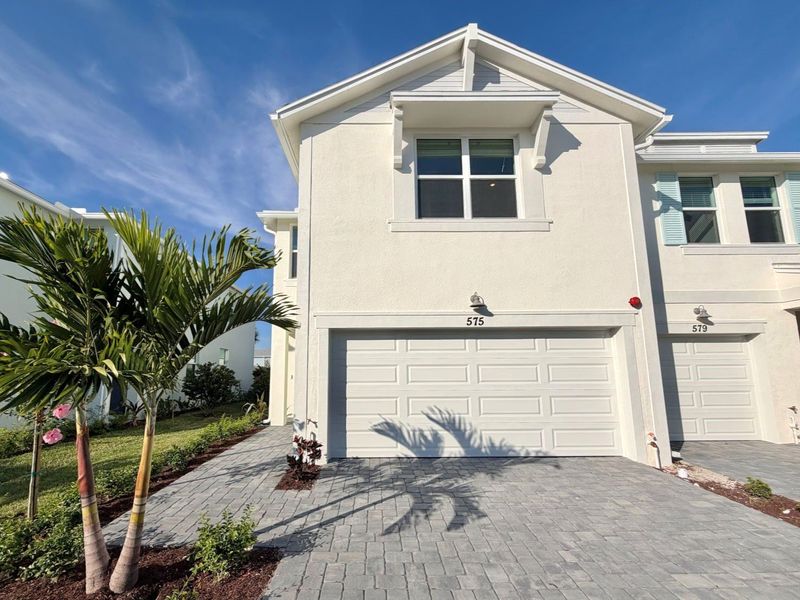 Front exterior of a new home in Tidewater, Fort Pierce, FL, highlighting curb appeal (Image 1). Front exterior of a new home in Tidewater, Fort Pierce, FL, highlighting curb appeal (Image 1).