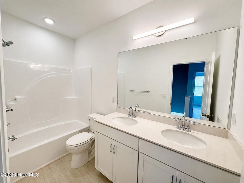 Furnished interior view inside a new home in Coastal Haven, Leland (Image 7).
