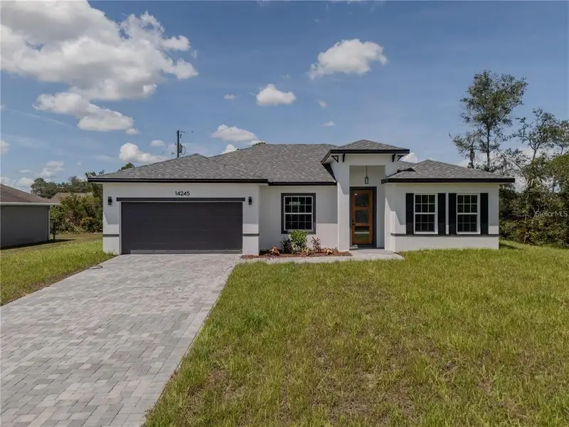 Front exterior of a new home in , Ocala, FL, highlighting curb appeal (Image 1). Front exterior of a new home in , Ocala, FL, highlighting curb appeal (Image 1).