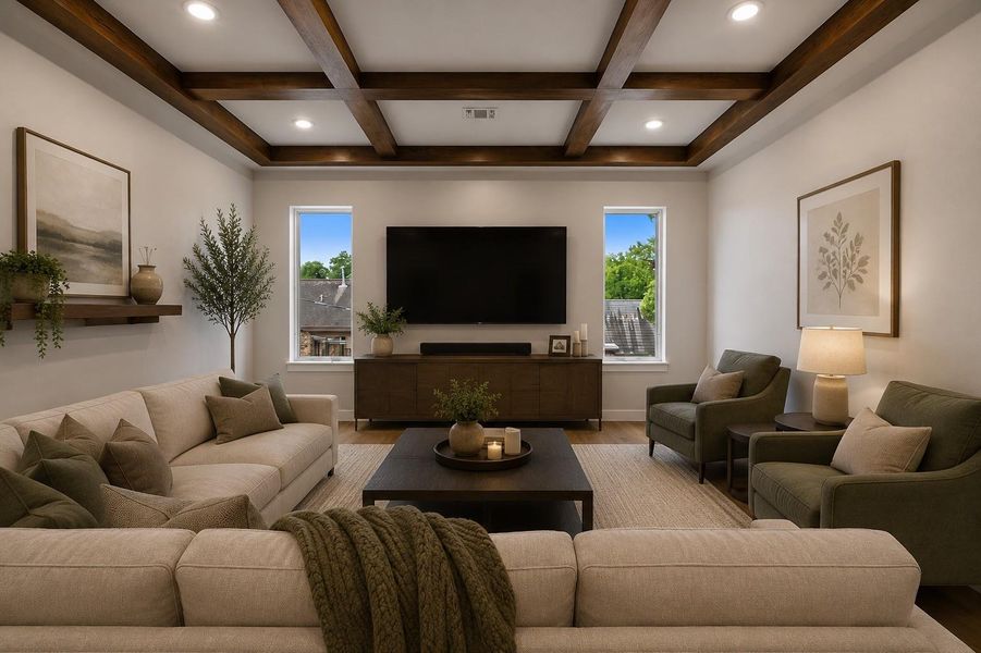 This inviting media room is thoughtfully designed for both everyday comfort, featuring a space for a large wall-mounted television, warm wood beam ceilings, and plush seating arranged for the perfect viewing experience. The perfect cozy gathering space. Virtually staged to illustrate furnishing possibilities