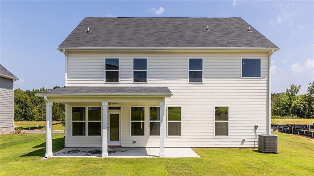 Exterior details and patio area of a home in Evergreen Crossing, Locust Grove (Image 2).