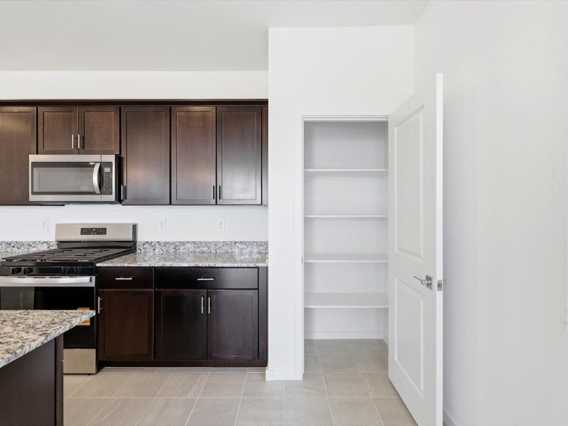 Furnished interior view inside a new home in Silva Farms - Classic Series, Goodyear (Image 5).