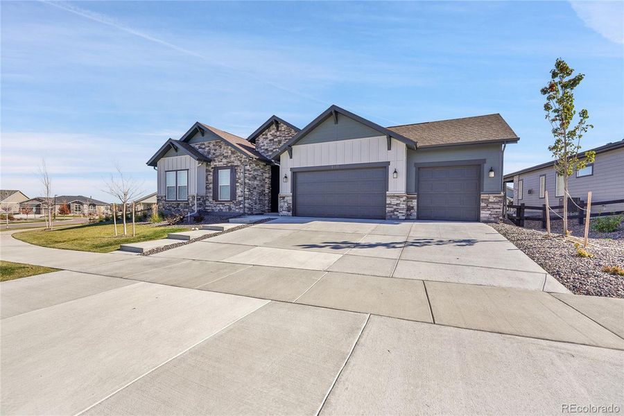 Front exterior of a new home in Hilltop at Inspiration, Aurora, CO, highlighting curb appeal (Image 26). Front exterior of a new home in Hilltop at Inspiration, Aurora, CO, highlighting curb appeal (Image 26).