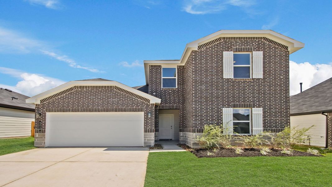 Front exterior of a new home in Silverthorne, Conroe, TX, highlighting curb appeal (Image 1).
