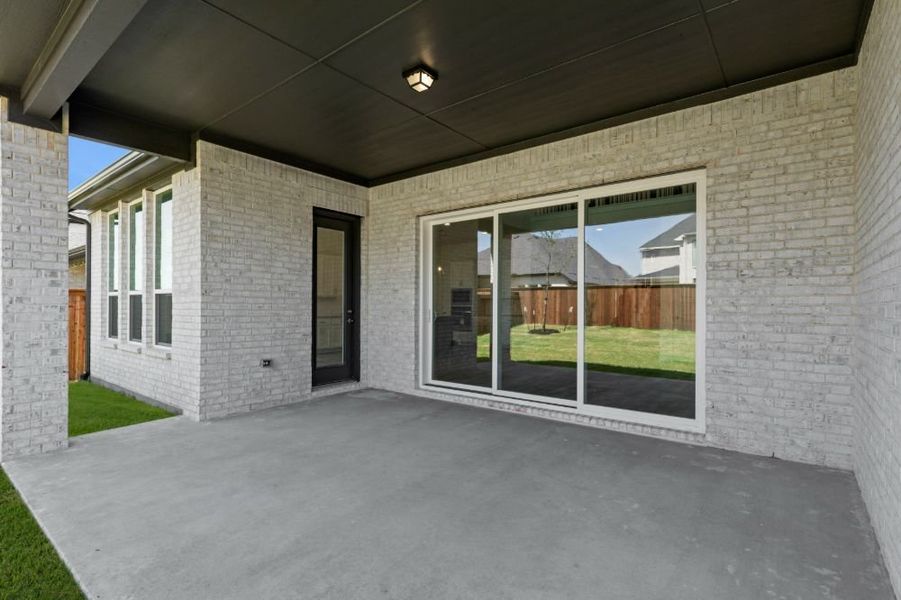 Exterior details and patio area of a home in Cambridge Crossing, Celina (Image 3). Exterior details and patio area of a home in Cambridge Crossing, Celina (Image 3).