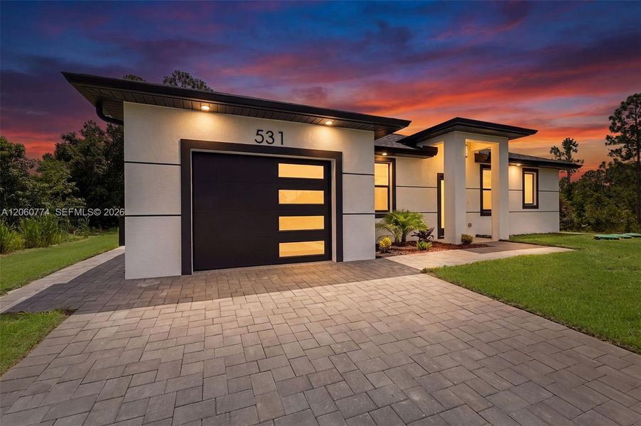 Front exterior of a new home in , Lehigh Acres, FL, highlighting curb appeal (Image 2). Front exterior of a new home in , Lehigh Acres, FL, highlighting curb appeal (Image 2).