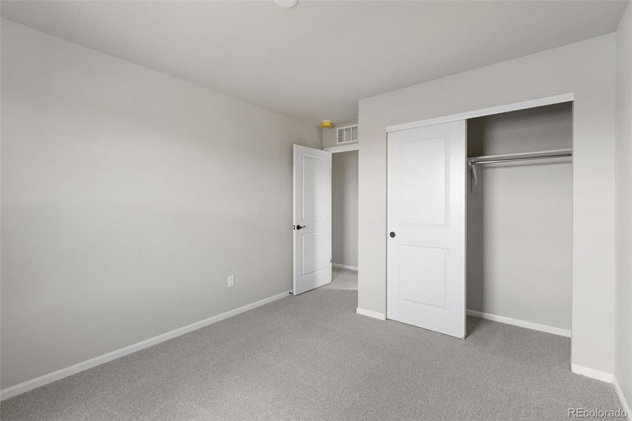 Spacious, unfurnished interior of a new home in The Legacy Collection at Talon Pointe, Thornton (Image 27).