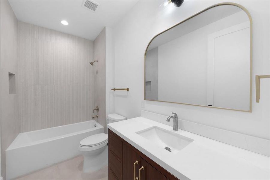 Bathroom featuring vanity, shower / tub combination, recessed lighting, and light tile patterned flooring