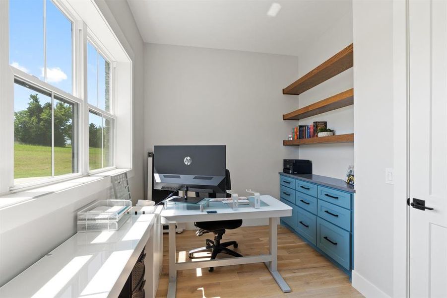 Office space featuring light wood-type flooring