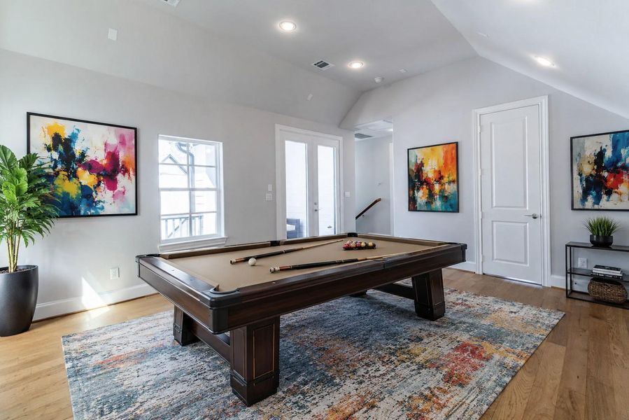 Bright third-floor game room leads out to the wrap-around rooftop terrace. Virtual staging added. Bright third-floor game room leads out to the wrap-around rooftop terrace. Virtual staging added.