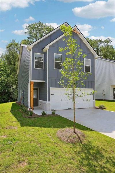 Front exterior of a new home in Campground Crossing, McDonough, GA, highlighting curb appeal (Image 2). Front exterior of a new home in Campground Crossing, McDonough, GA, highlighting curb appeal (Image 2).