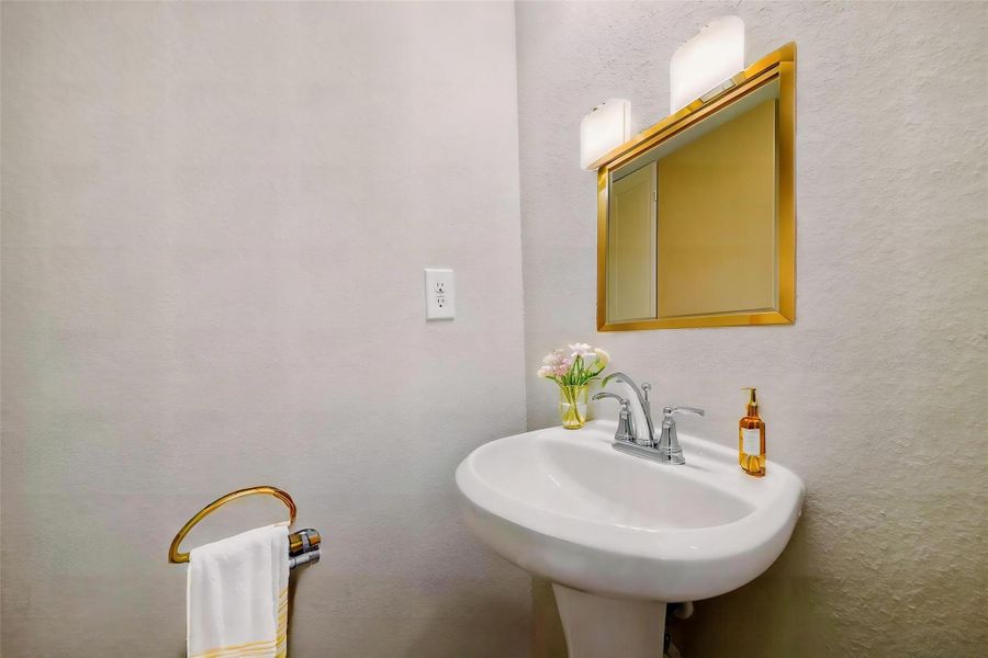 Step into this well-appointed half bath.