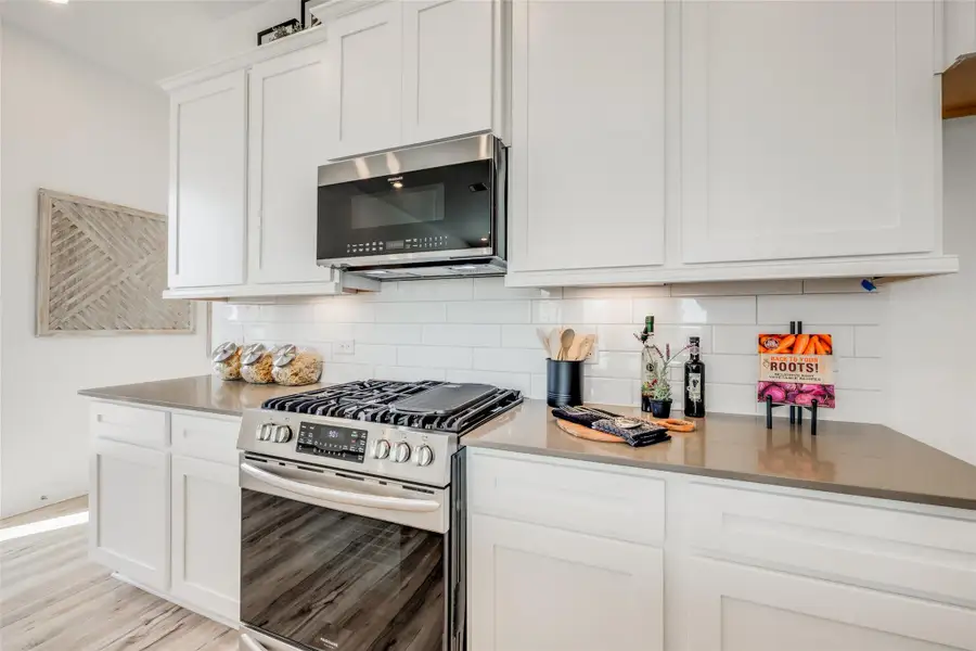 Furnished interior view inside a new home in Bridgeland, Cypress (Image 6).