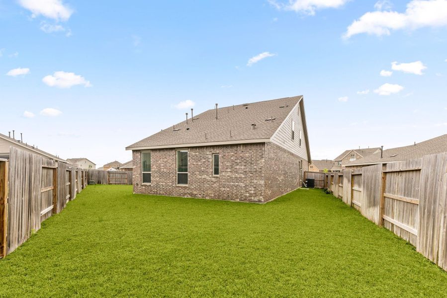 Exterior details and patio area of a home in Sunterra, Katy (Image 22).