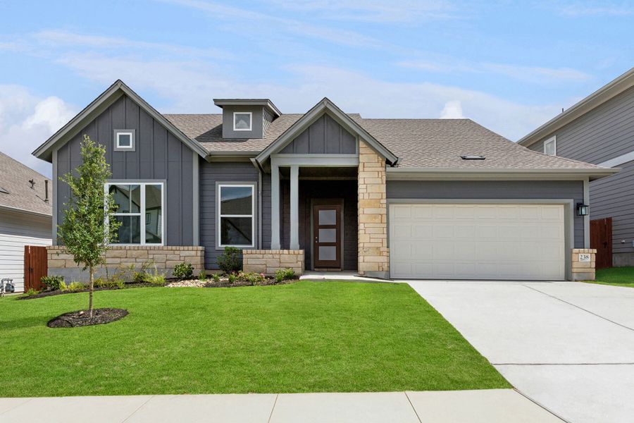 Representative exterior photo of a completed home built from the The Carrington by David Weekley Homes in Sunfield, Buda, TX (Image 4). Representative exterior photo of a completed home built from the The Carrington by David Weekley Homes in Sunfield, Buda, TX (Image 4).