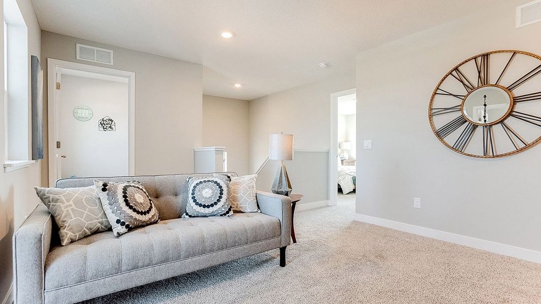 Representative furnished interior of a home built from the The Sienna by D.R. Horton in Thornton Townes, Raleigh (Image 14).