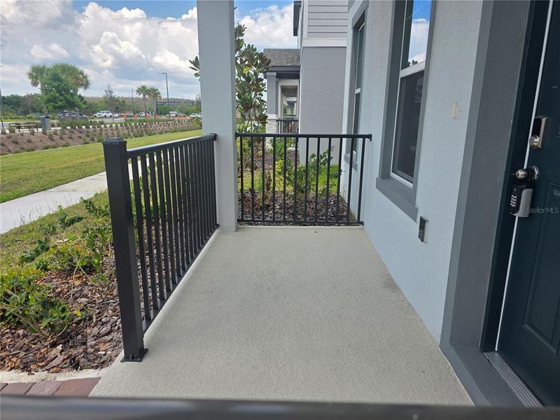 Exterior details and patio area of a home in The Meadow at Crossprairie Bungalows, St. Cloud (Image 3).