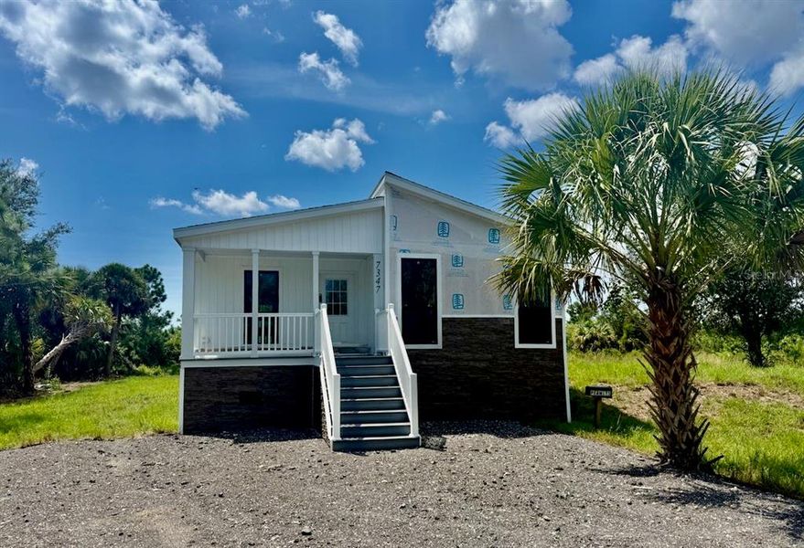 Front exterior of a new home in , Punta Gorda, FL, highlighting curb appeal (Image 31). Front exterior of a new home in , Punta Gorda, FL, highlighting curb appeal (Image 31).