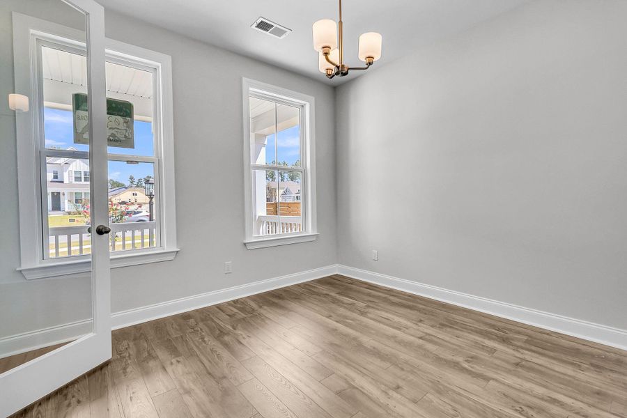 Spacious, unfurnished interior of a new home in Tidewater at Lakes of Cane Bay, Summerville (Image 32).