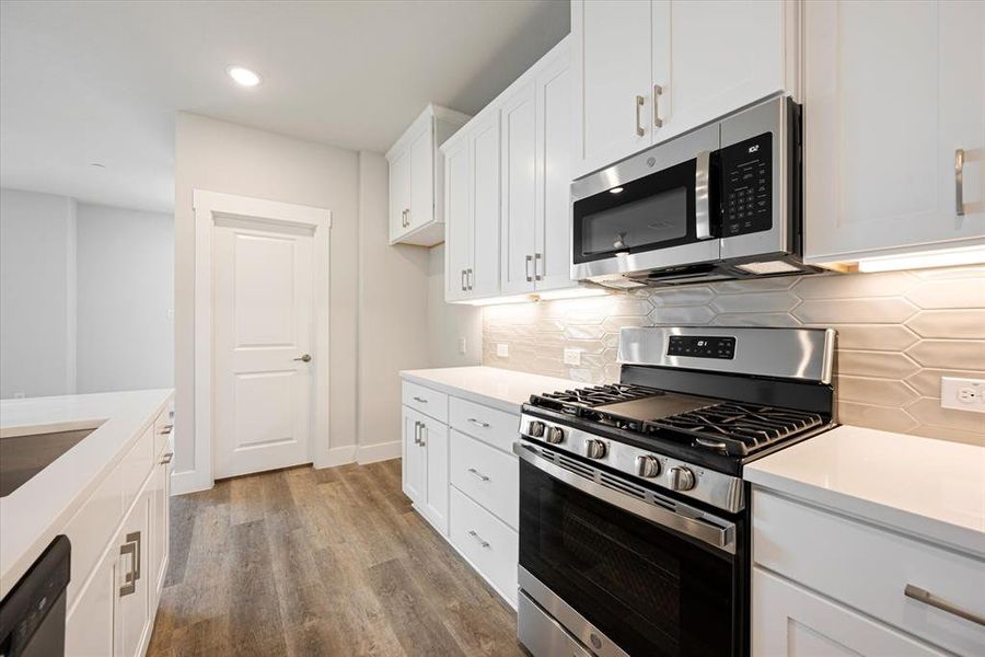 Beautiful stainless steel appliances are only one of the many upgrades in this fantastic home!