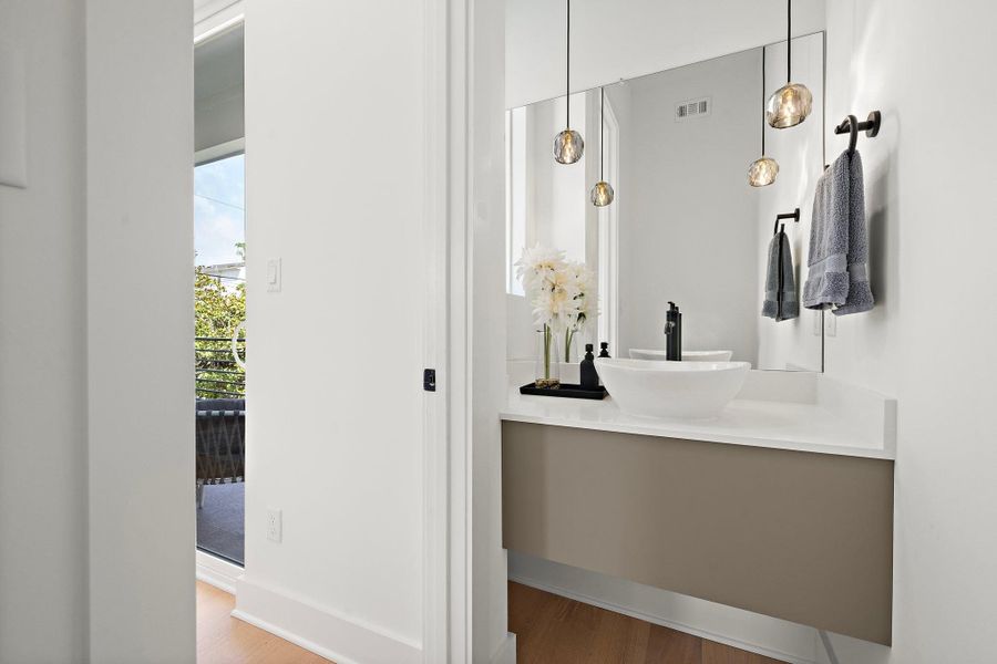 A simple yet charming half bathroom located on the second floor. A simple yet charming half bathroom located on the second floor.