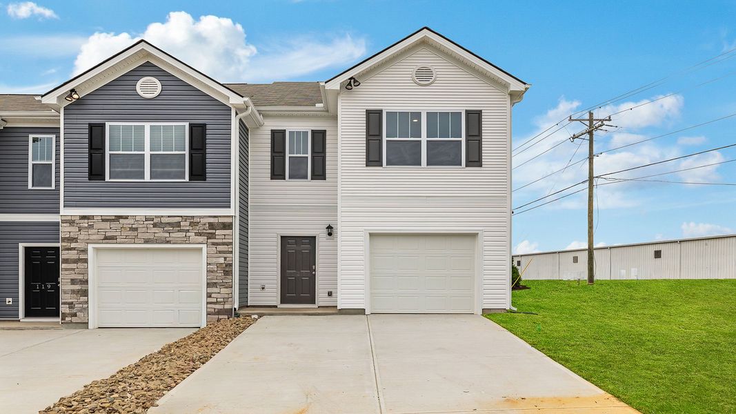 Front exterior of a new home in Tanglewood Townes, Greenville, SC, highlighting curb appeal (Image 1).