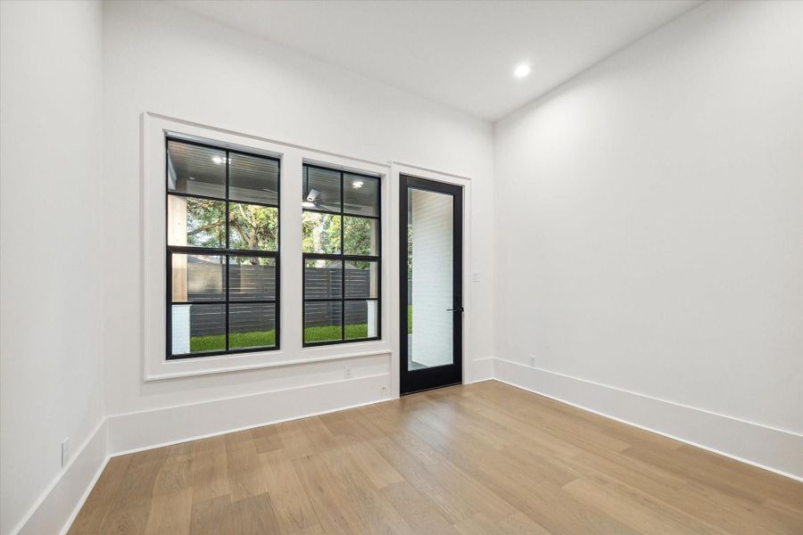 Downstairs guest suite with bath en-suite and back patio access*Picture is of a recently constructed home by the builder.  1519 Candlelight will be similar in quality, but these pictures are not meant to be an exact representation of the new home. Specs of home may change at sole discretion of the seller.