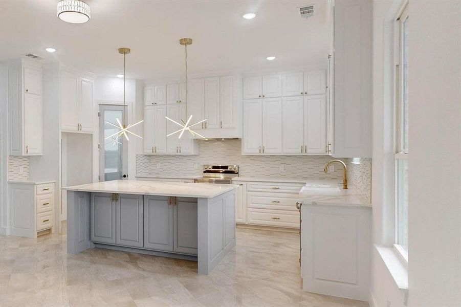 Kitchen featuring gray cabinetry, light stone counters, white cabinetry, stainless steel electric range, and decorative light fixtures