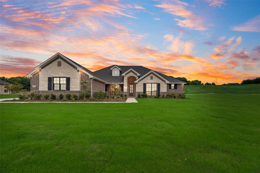 Front exterior of a new home in King Crossing Estates, Van Alstyne, TX, highlighting curb appeal (Image 17). Front exterior of a new home in King Crossing Estates, Van Alstyne, TX, highlighting curb appeal (Image 17).