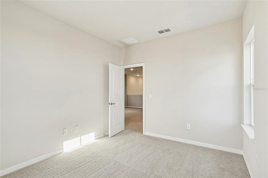Spacious, unfurnished interior of a new home in Laureate Park at Lake Nona - Garden Series, Orlando (Image 29).