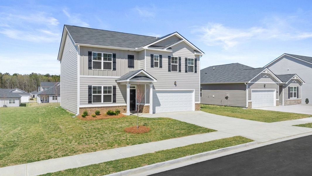 Front exterior of a new home in Captain's Corner, Grovetown, GA, highlighting curb appeal (Image 2). Front exterior of a new home in Captain's Corner, Grovetown, GA, highlighting curb appeal (Image 2).