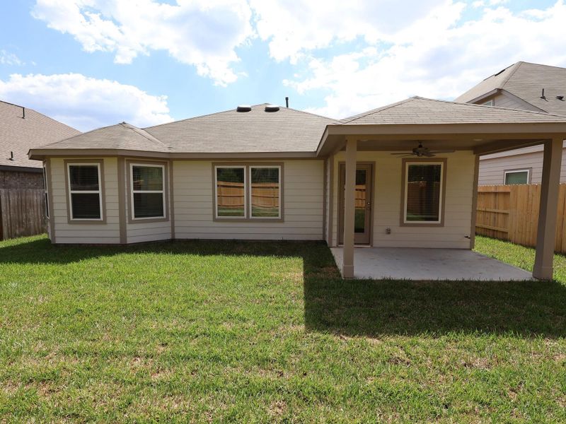 Exterior details and patio area of a home in Pinewood at Grand Texas, New Caney (Image 4).