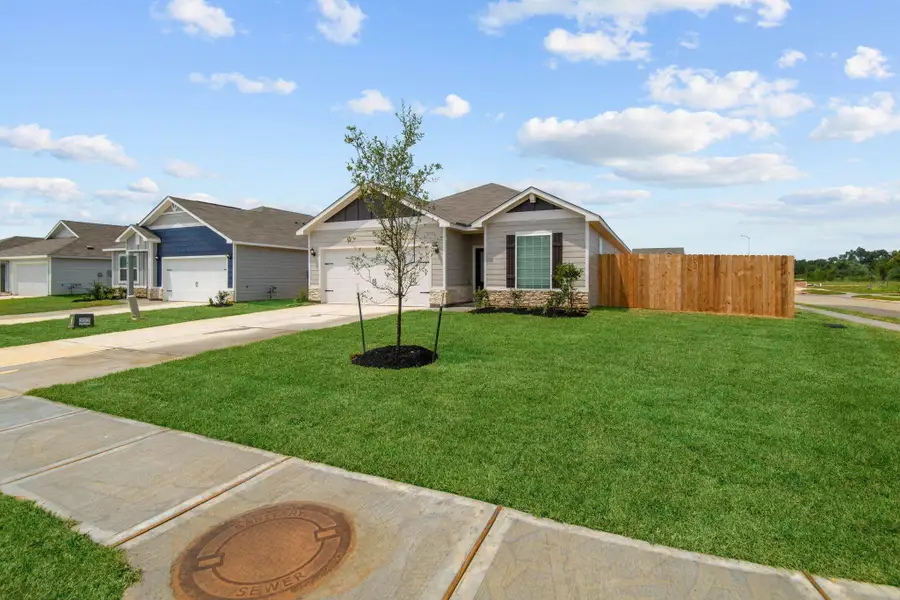 Front exterior of a new home in Trails at Cochran Ranch, Waller, TX, highlighting curb appeal (Image 17). Front exterior of a new home in Trails at Cochran Ranch, Waller, TX, highlighting curb appeal (Image 17).